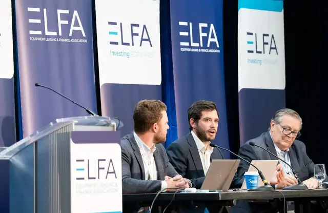 Panelists speak during an ELFA conference session.